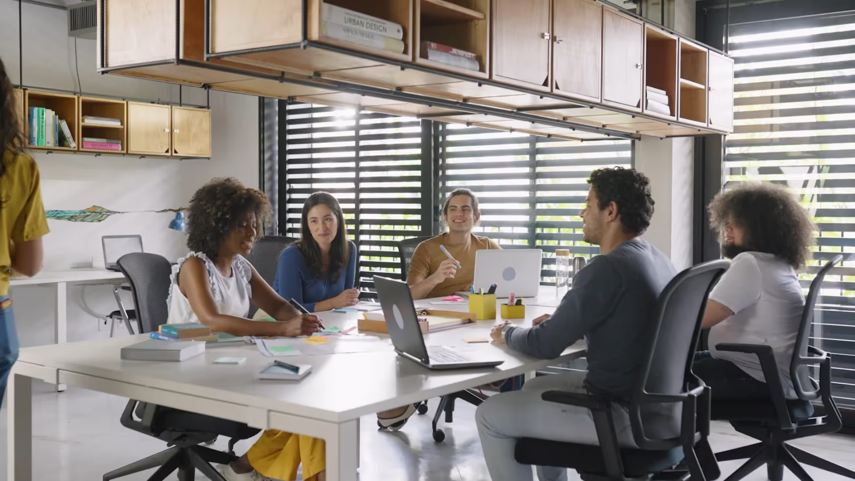 Team meeting at a white rectangle table